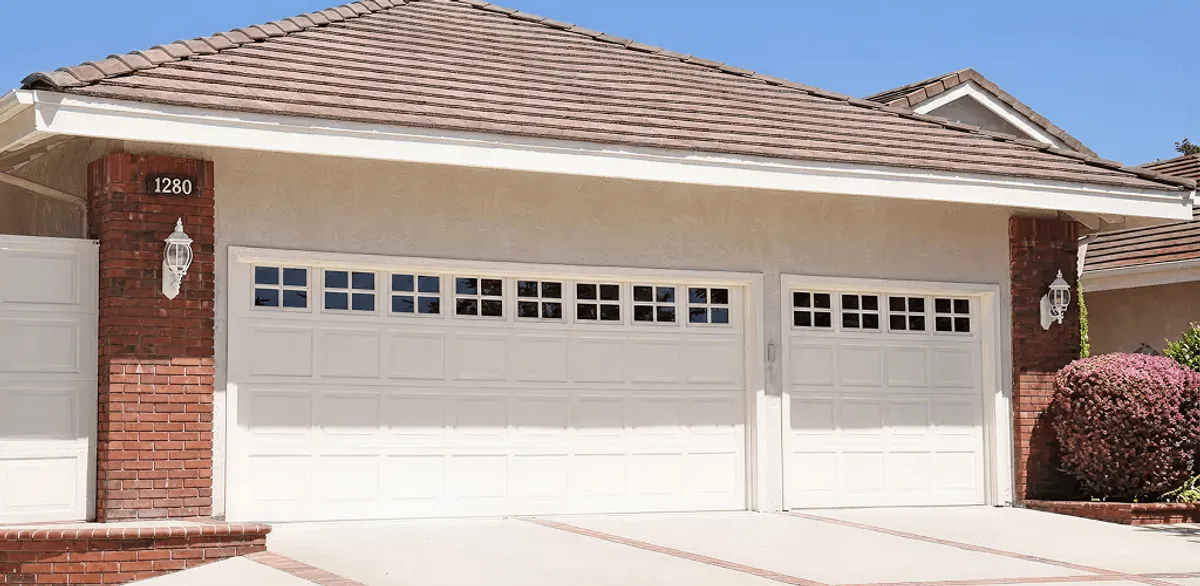 Residential garage door repair service for a double garage door in Anchorage, AK