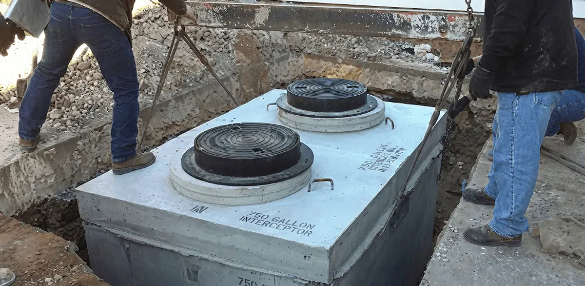 Grease trap installation for a commercial property drainage system in Anchorage, AK